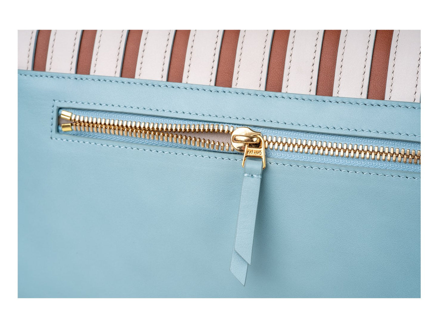 Fine hardware and detail of fan crossbody bag