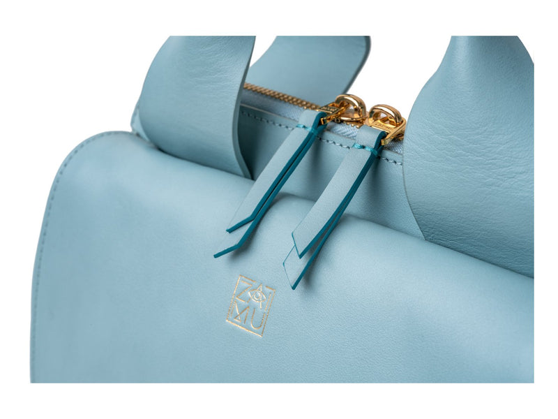 designer crossbody bag in mint blue